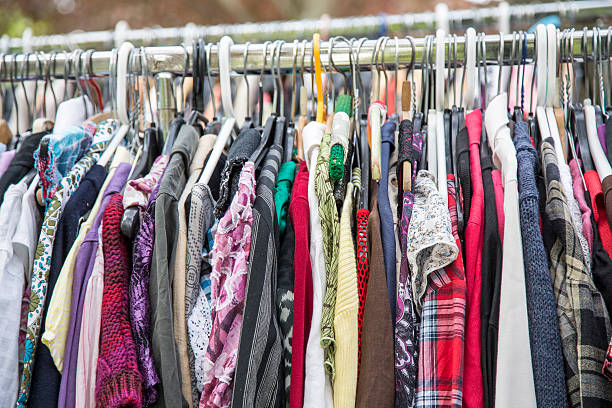 istock clothes on a rack in a flea market 488910425