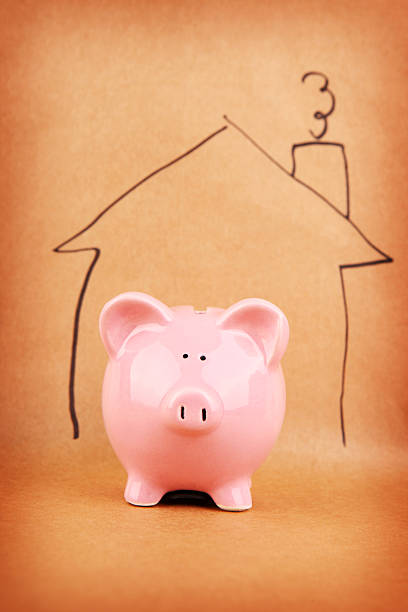 istock Piggybank in a drawn house 488910475