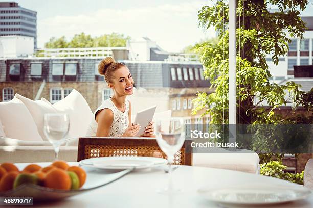 Elegant Woman With Digital Tablet Stock Photo - Download Image Now - Laughing, Luxury, Women