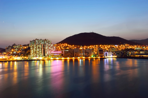 skyline at night with Seo-gu district in Busan, South Korea