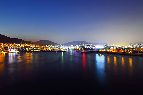 skyline at night with Seo-gu district in Busan, South Korea