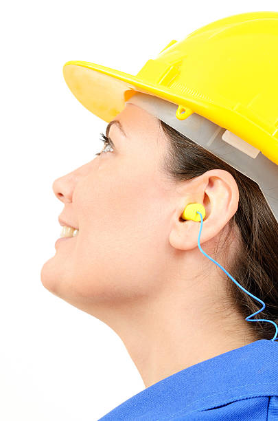 istock Woman with protective equipment and ear plugs 488911103