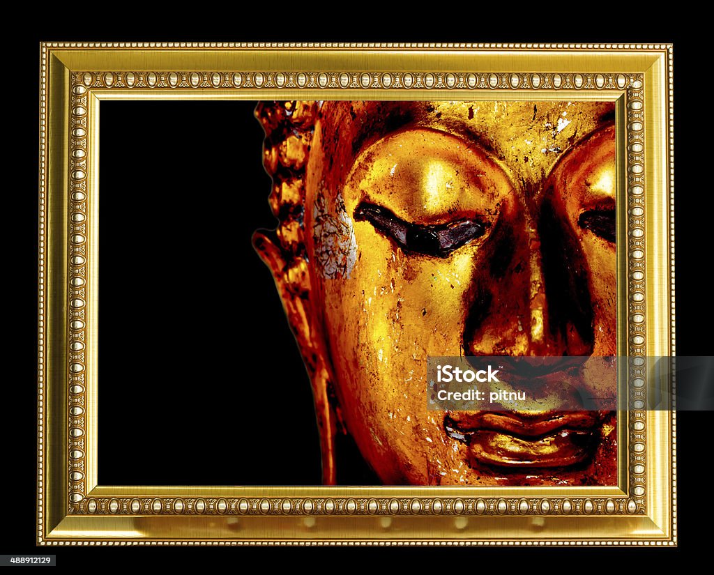 Buddha face in gold frame. Ancient Stock Photo