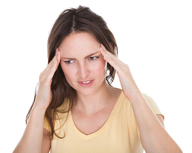 istock Woman Suffering From Headache 488912235