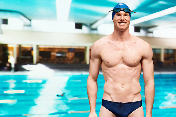 istock Cheerful athlete in front of swimming pool 488912317