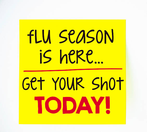 istock Flu season and flu shot reminder on sticky note 488912390