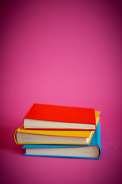 istock Colorful Albums on Magenta Background 488912566