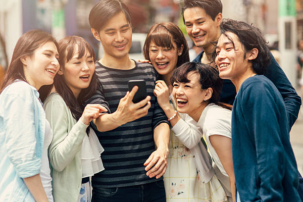 istock Happy japanese friends taking a selfie 488912588