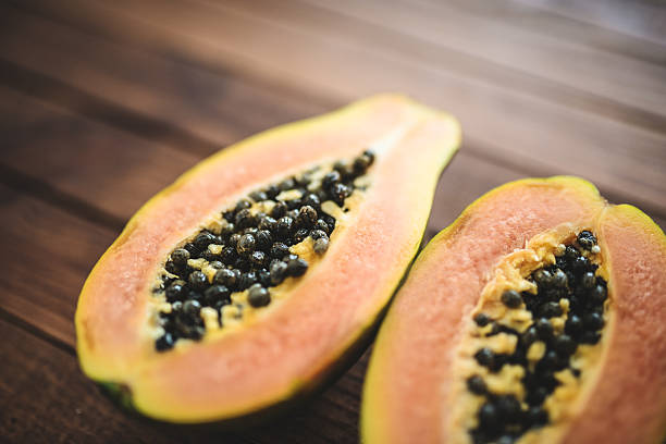 istock papaya on vintage plank wood 488912763