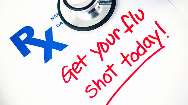 istock Flu shot reminder on RX prescription form with stethoscope 488912816