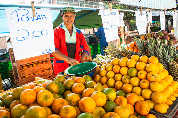 street market Sao Paulo, Brazil, June 05, 2008. orange fruit sold in a street market in the city of São Paulo, Brazil. Vendors of this street market work only in the morning. market vendor stock pictures, royalty-free photos & images