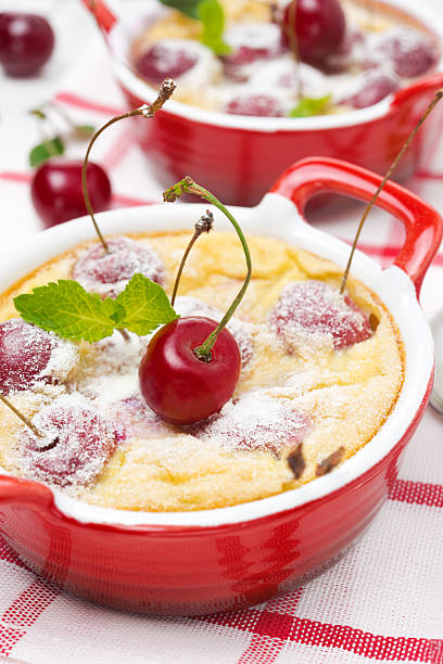 istock Casserole (clafoutis) with cherry in the ramekin, close-up 488913843