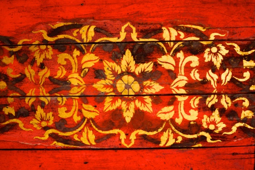 the detail of  thai gold painting pattern on ancient  wood plate,shallow focus,Lampang temple,Thailand