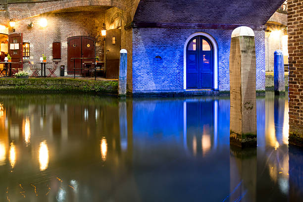 Wharf level night view under bridge of Oudegracht canal in the old city centre of Utrecht, Netherlands