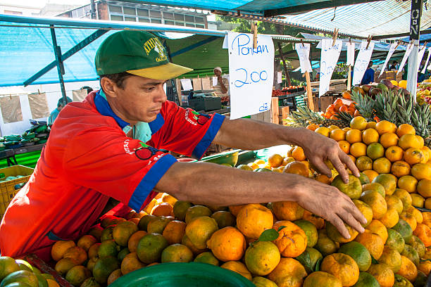 Sao Paulo, Brazil, June 05, 2008. Orange fruit sold in a street market in the city of São Paulo, Brazil. Vendors of this street market work only in the morning.