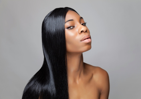 Young black beauty with long straight hair