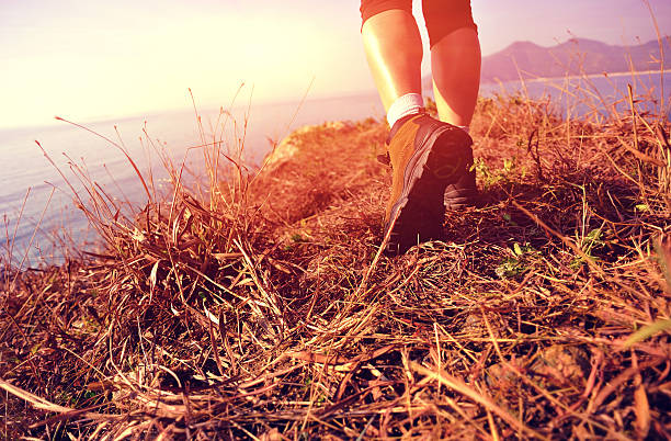 istock hiking feet seaside mountain peak 488914823