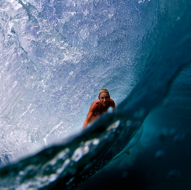 istock Surfer girl in a big barrel 488915254