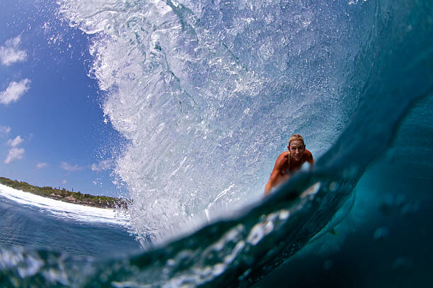 istock Surfer girl in a big barrel 488915332