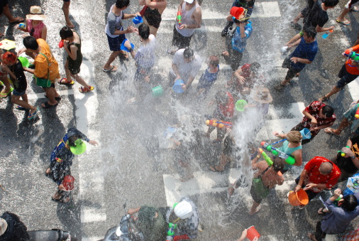 The Songkran festival (Thai: สงกรานต์) is a nationwide water festival celebrated in Thailand as the traditional New Year's Day from 13-15 April. Traditionally a sign of respect and well-wishing, the throwing of water has become more than just a polite sprinkling. During Songkran, people throughout Thailand crowd the streets with overflowing buckets and water pistols – anyone is fair game, nationals and tourists alike!