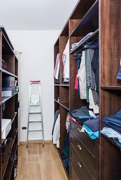 istock interior of walkin closet full with clothes 488937139