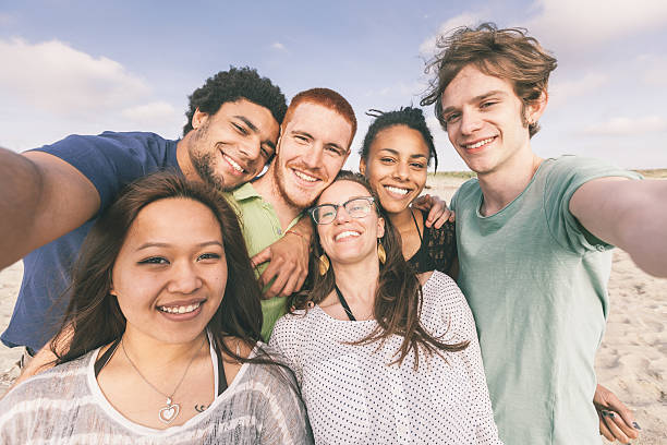 istock Multiracial Group of Friends Taking Selfie at Beach 488938989