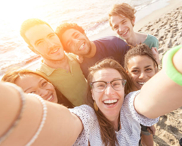 istock Multiracial Group of Friends Taking Selfie at Beach 488939569