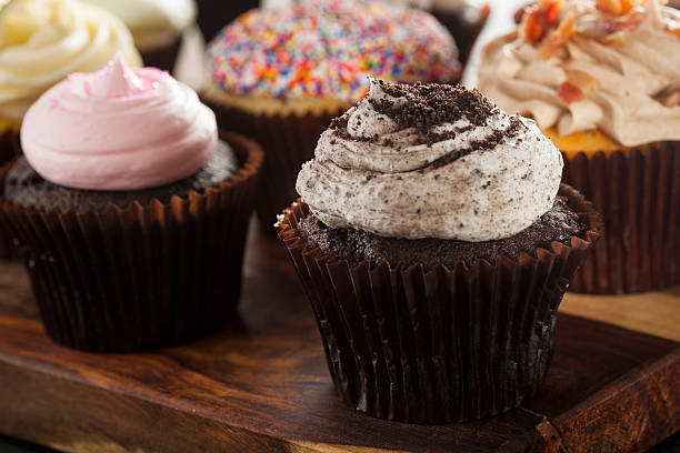 istock Assorted Fancy Gourmet Cupcakes with Frosting 488941019
