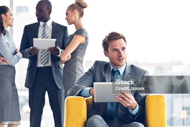 Businessman With Digital Tablet Stock Photo - Download Image Now - 20-24 Years, Adult, Adults Only