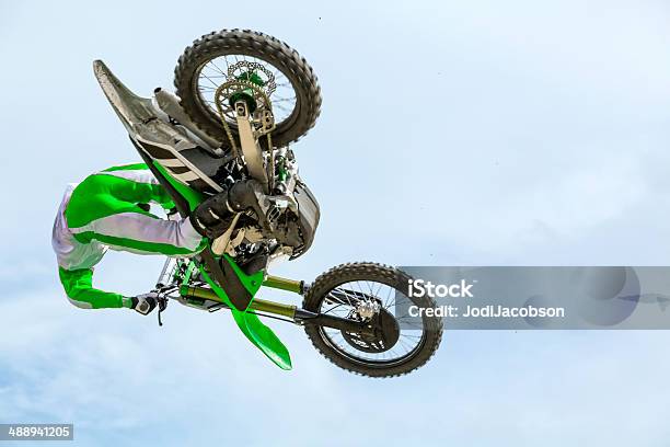 Man On A Dirt Bike Mid Air Stock Photo - Download Image Now - Green Color, Motocross, Activity
