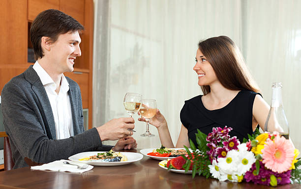 istock man and woman having romantic dinner 488942061