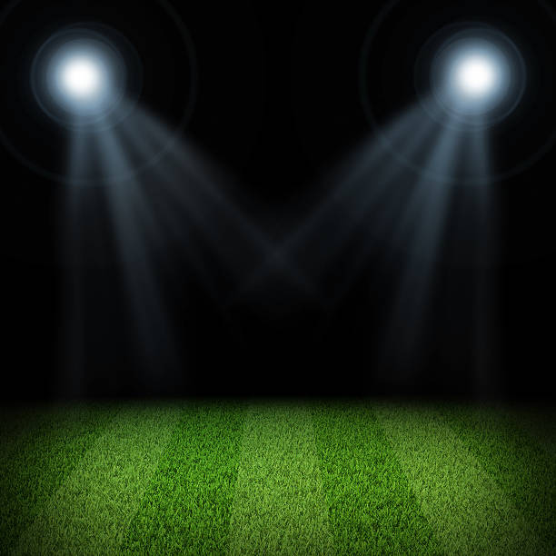 istock Night football arena illuminated by spotlights 488942473