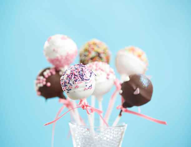 istock Cakepops Standing in a Glass over Blue 488942789