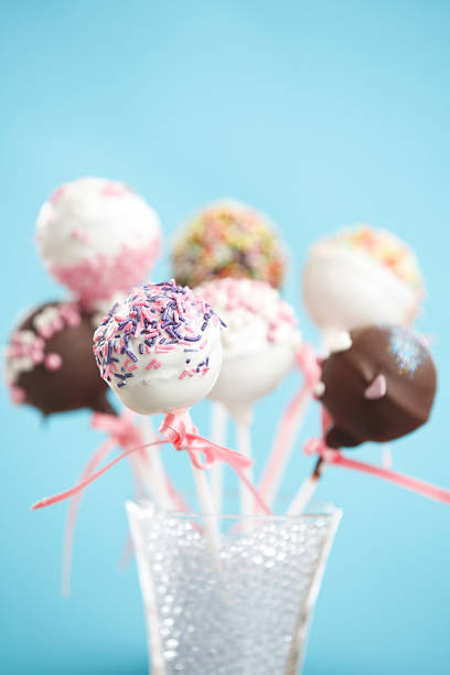 istock Cakepops Standing in a Glass over Blue 488942797