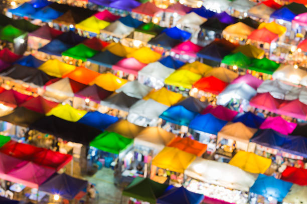 istock Abstract blurred multiple colours umbrella of weekend market 488952168