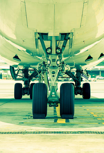 istock Airplane parked at the airport. Split tining 488953134