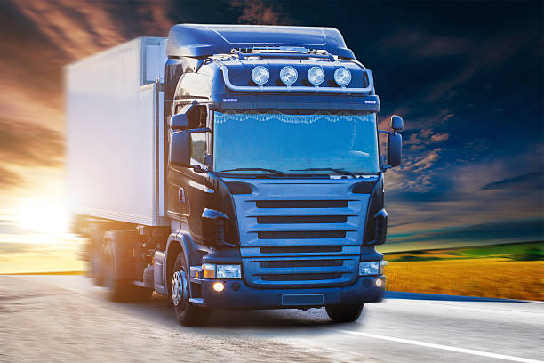 istock Blue truck on highway 488955098