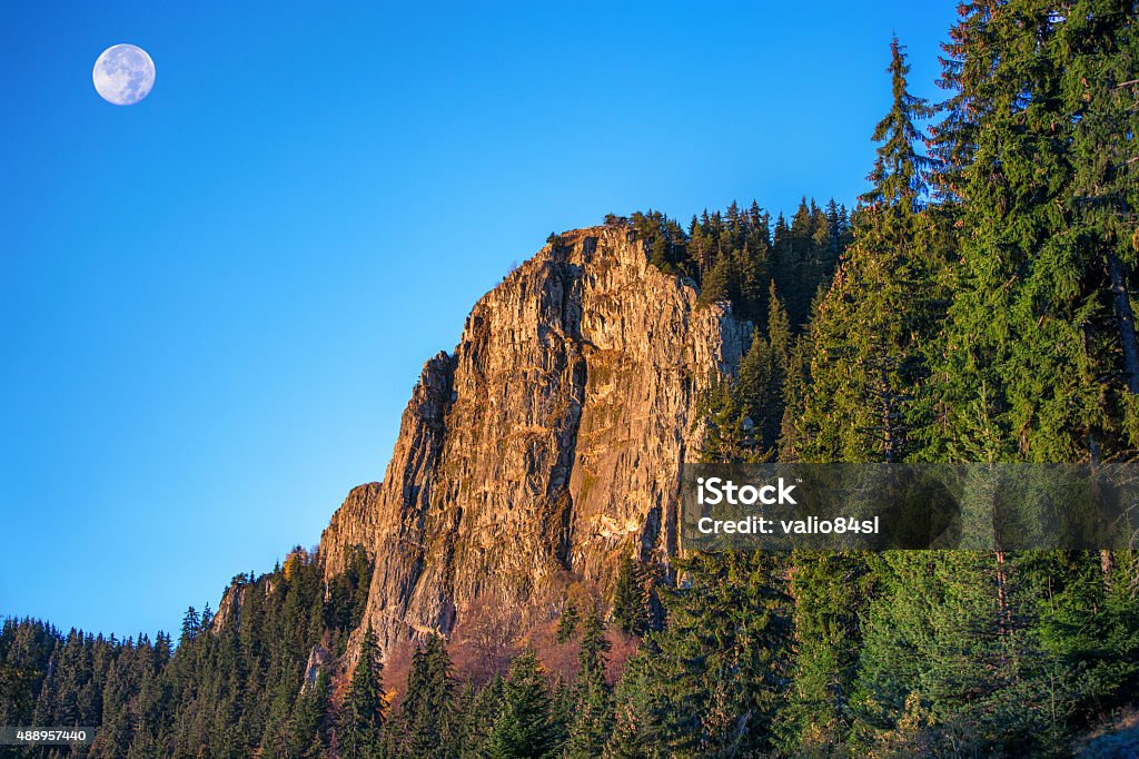 Morning sunrise and the Moon over mountain hill Morning sunrise and the Moon over the mountain hill 2015 Stock Photo