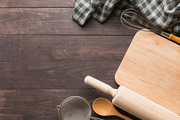 istock Wooden kitchen tools and napkin on the wooden background 488957788