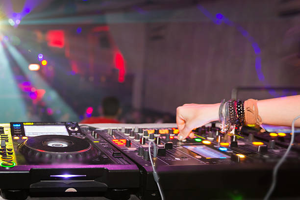 istock Female DJ playing in nightclub 488959136