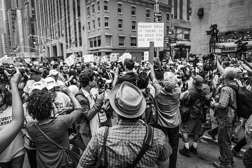 New York, USA - September 21, 2014: Black and white image of journalists and paparazzi crowding around celebrities attending the international Peoples Climate March demonstrating against global climate change and environmental degradation, Manhattan, New York, September 2014.