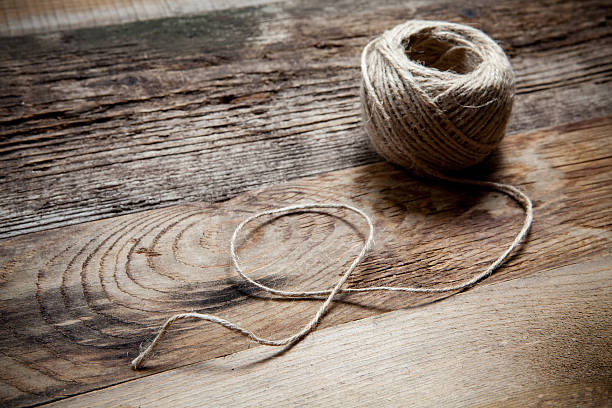 istock Rope coil on wooden table 488960103