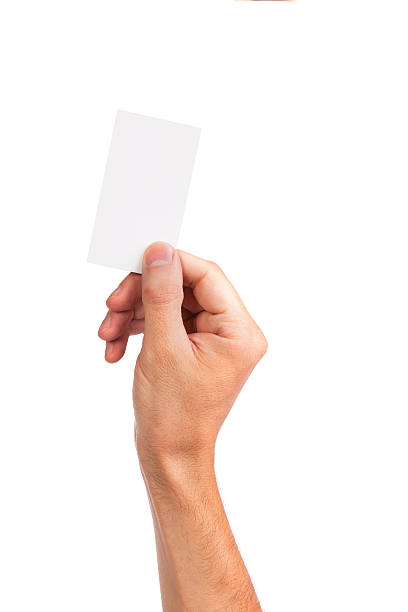 Businessman's hand holding blank business card Businessman's hand holding blank paper business card, closeup isolated on white background men hands stock pictures, royalty-free photos & images