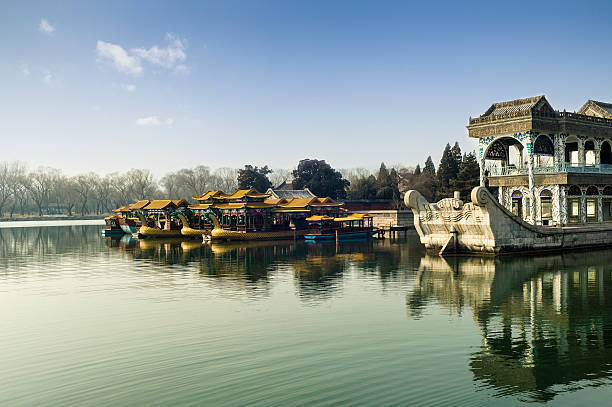 istock Dragon boats and the ancient stone boat 488960753