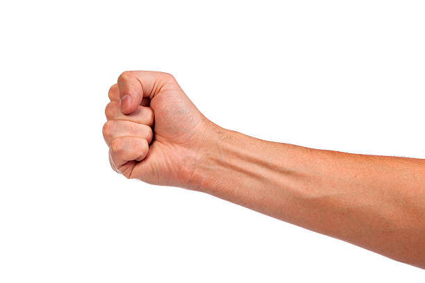 istock Males hand with a clenched fist isolated 488961703