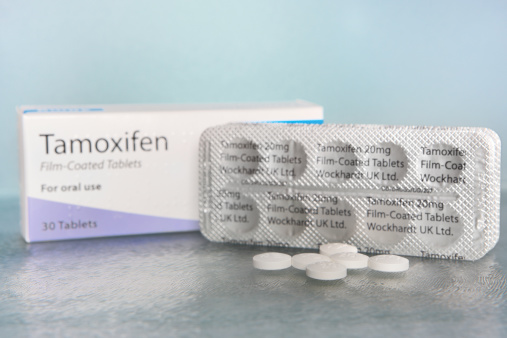 Maidstone, United Kingdom - May,2nd 2014:A carton together with packs and individual 20 mg tablets of Tamoxifen, manufactured by Pharmaceutical company Wockhardt UK Ltd. Tamoxifen is a drug used primarily in the treatment of Breast Cancer.