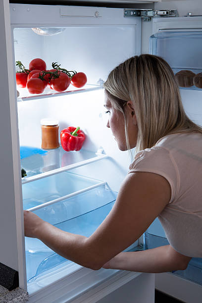 istock Woman Searching In Refrigerator 488963883