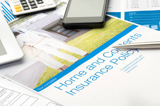 istock Home and contents insurance document with paperwork 488974871