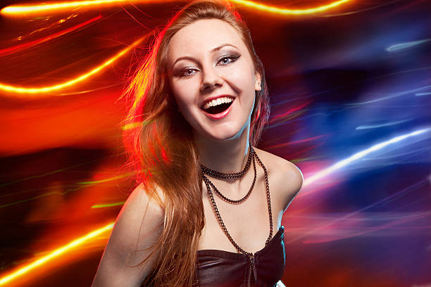 istock Clubber dancing and looking at camera with smile 488976053