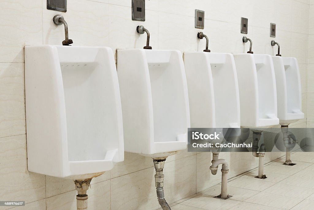 Public Urinals Public Urinals,in a row. Change Stock Photo